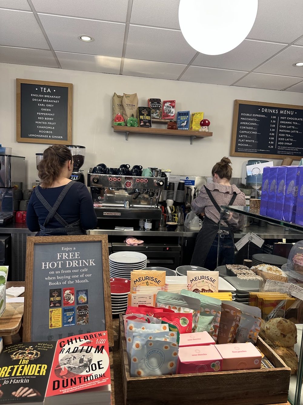 The service counter with staff working behind it