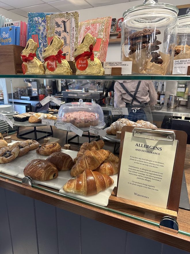 Croissants, cookies and tray bakes in the counter display
